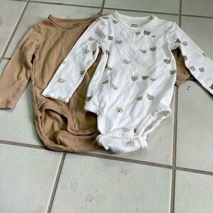 Two H&M long-sleeve bodysuits. Size 9 months.